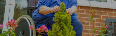 elderly in wheelchair outside with adult diaper
