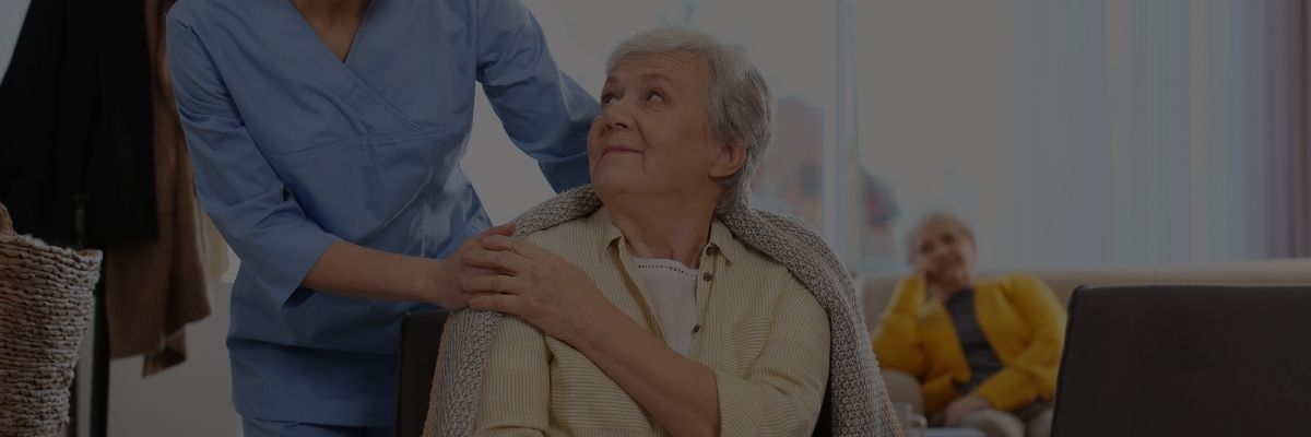 elderly mom and daughter touching hands