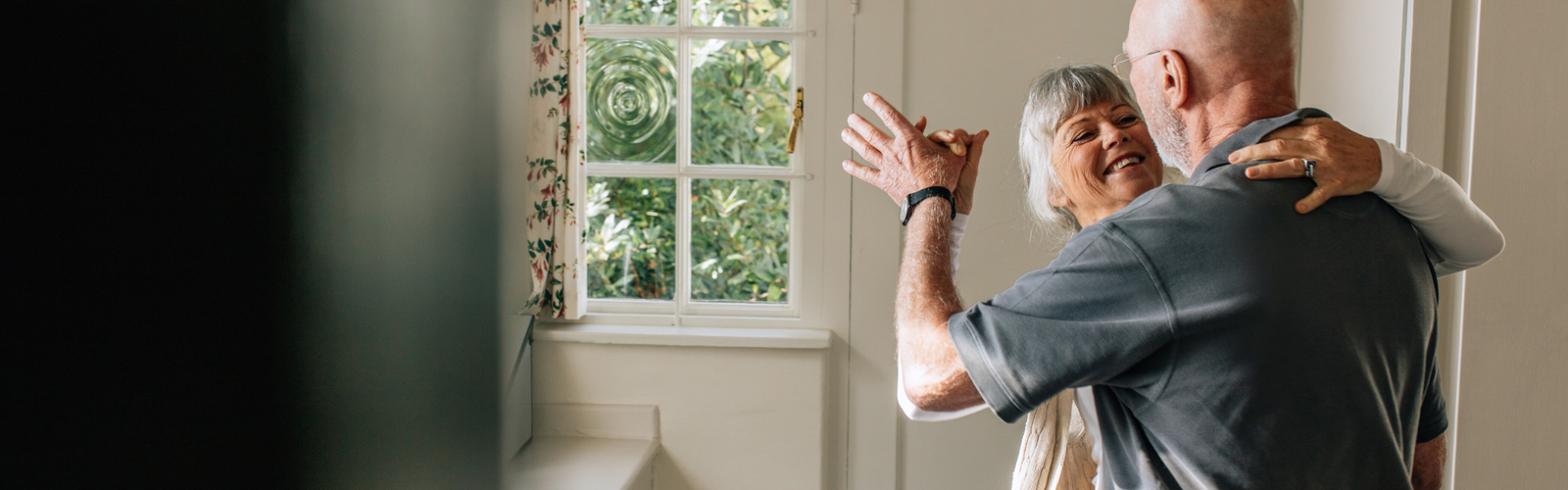 old couple dancing in kitchen