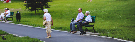 old people walking sitting park